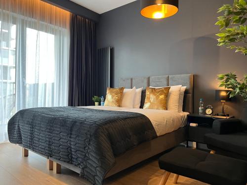 Posteľ alebo postele v izbe v ubytovaní Unique Apartment Katowice City Center