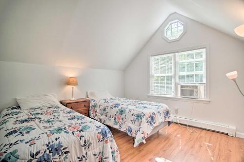 a bedroom with two beds and a window at 1 Mi to Beach Home with Deck and BBQ in East Falmouth in East Falmouth