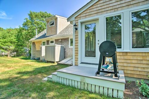 a porch with a grill on the front of a house at 1 Mi to Beach Home with Deck and BBQ in East Falmouth in East Falmouth