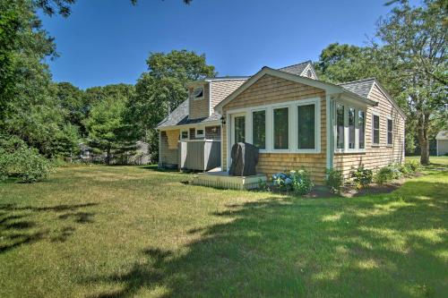 a small house with a yard with a yard at 1 Mi to Beach Home with Deck and BBQ in East Falmouth in East Falmouth