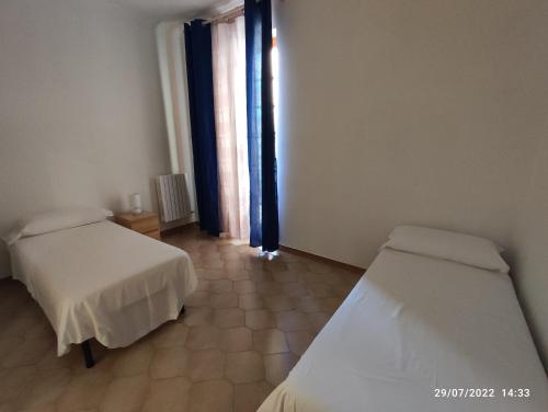 Postel nebo postele na pokoji v ubytování B&B dell'Assunta