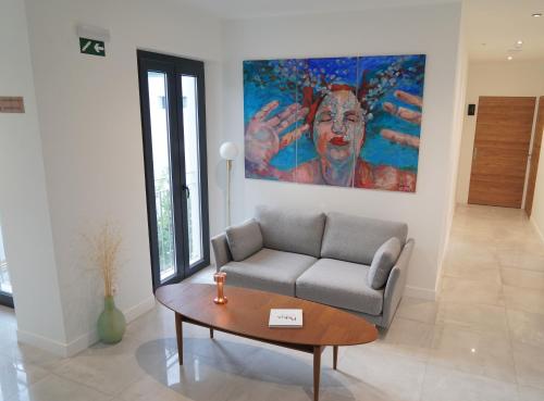 a living room with a couch and a table at OPUNTIA Hotel Boutique in Mijas