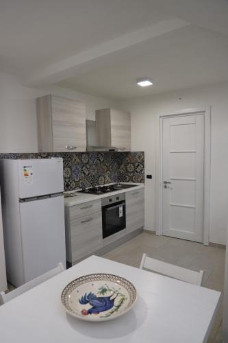 a kitchen with a table with a plate on top of it at La Neviera in Struda