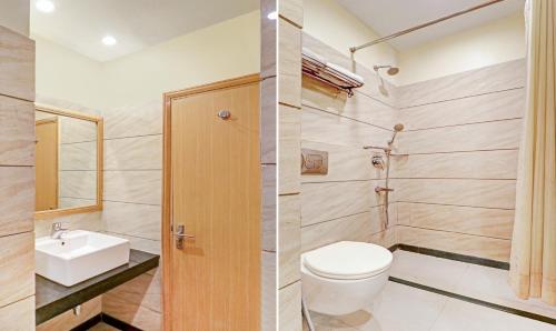 a bathroom with a toilet and a sink at Treebo Galaxy Rooms in New Delhi