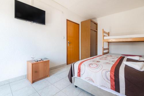 Ένα ή περισσότερα κρεβάτια σε δωμάτιο στο Apartments MIRA