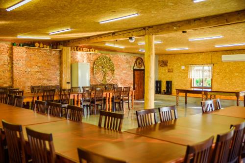 a large room with tables and chairs in it at Kivimaa Puhkemaja in Tiidu