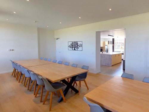 a large dining room with a table and chairs at Vakantiehoeve Walleboom in Lo-Reninge