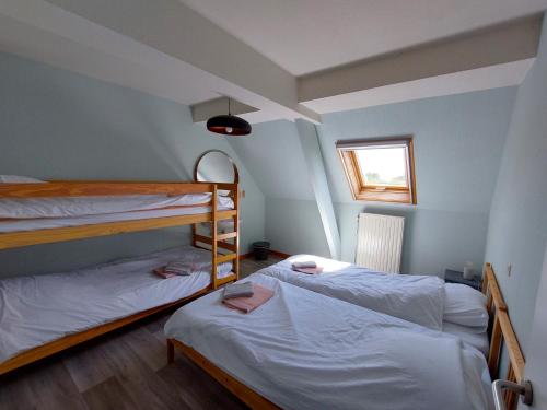Postel nebo postele na pokoji v ubytování Vakantiehoeve Walleboom