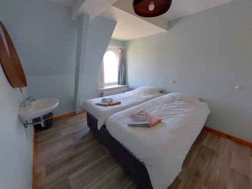 Postel nebo postele na pokoji v ubytování Vakantiehoeve Walleboom