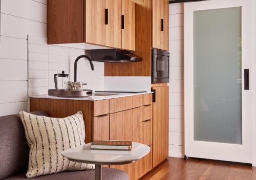 a kitchen with a couch and a table at AutoCamp Cape Cod in Falmouth