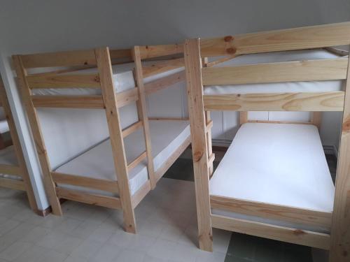 a couple of bunk beds in a room at Albergue de Siresa in Siresa
