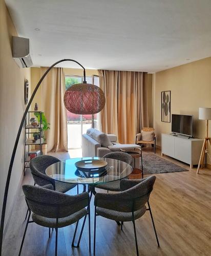 a living room with a table and chairs at Flats 323 apartments in Porto