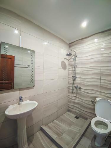 a bathroom with a toilet and a sink at Chrysiis House 1 in Maltezana