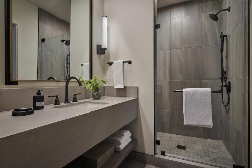 a bathroom with a sink and a shower at Pendry Park City in Park City