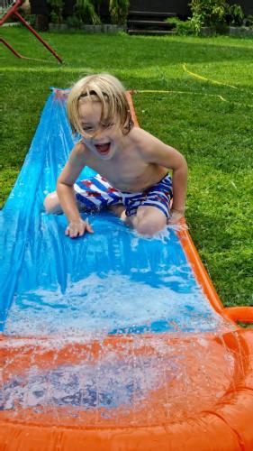 a young child playing in an inflatable at fun4all-holidayhome in Medebach