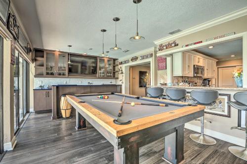 a kitchen with a pool table in a room at Luxe Cape Coral Escape with Pool 4 Mi to Beach in Cape Coral