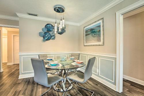 a dining room with a glass table and chairs at Luxe Cape Coral Escape with Pool 4 Mi to Beach in Cape Coral