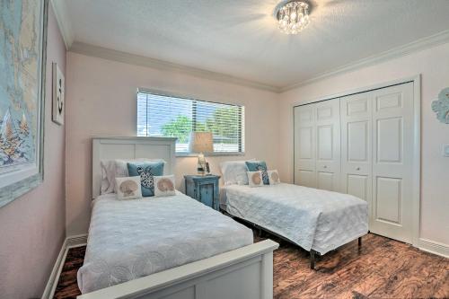 a bedroom with two beds and a window at Luxe Cape Coral Escape with Pool 4 Mi to Beach in Cape Coral