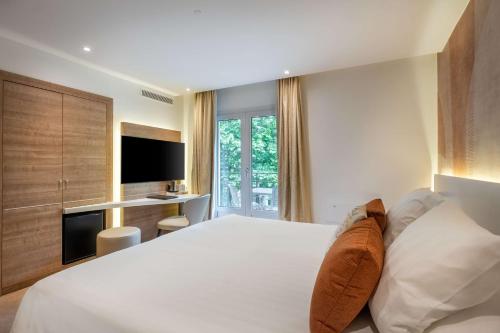 Ένα ή περισσότερα κρεβάτια σε δωμάτιο στο Best Western Premier Hotel Prince de Galles