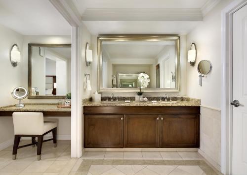 a bathroom with a sink and a mirror at Balboa Bay Resort in Newport Beach