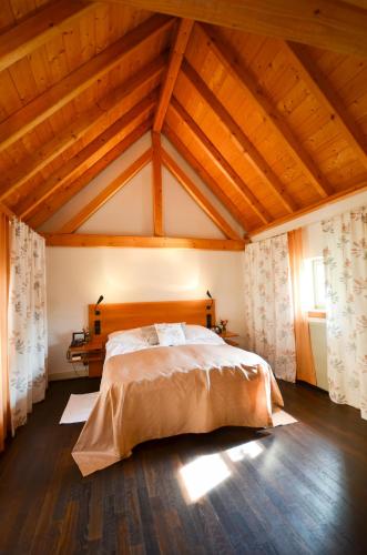 a bedroom with a large bed in a attic at Restaurant & ****Hotel HÖERHOF in Idstein
