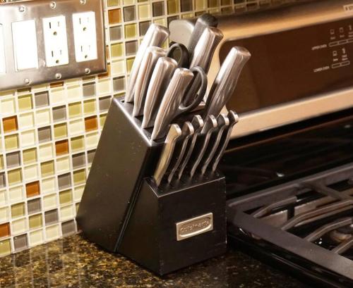 a black block of knives sitting next to a stove at Luxury 1 Bedroom Unit-Walk to Beach -Baby Friendly in Los Angeles