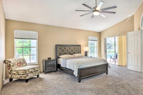 a bedroom with a bed and a chair and windows at Pet-Friendly Port St Lucie Home - 7 Mi to Beaches! in North River Shores