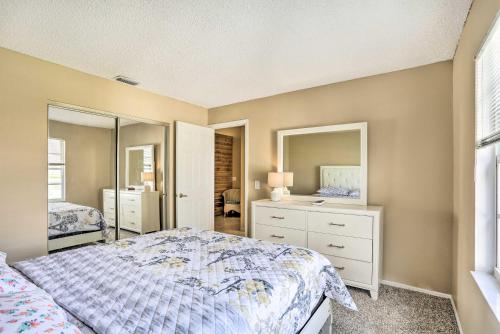 a bedroom with a bed and a dresser and mirror at Pet-Friendly Port St Lucie Home - 7 Mi to Beaches! in North River Shores