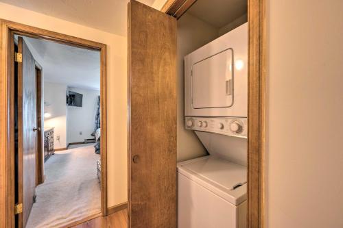 a small laundry room with a washer and dryer at Campton Retreat with Mtn Views about 3 Mi to Skiing in Campton