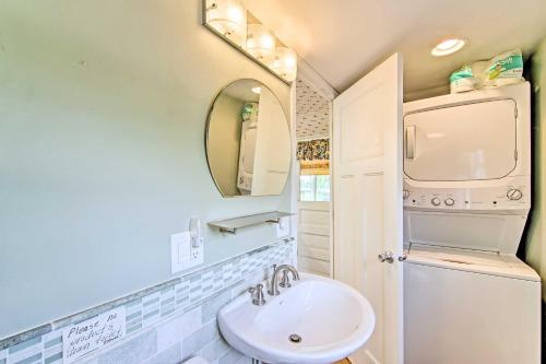 a bathroom with a sink and a mirror at Charming Horicon Cottage and Dock on Rock River in Juneau