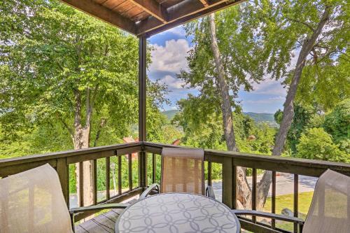 a balcony with a table and chairs and trees at Sun-Lit Vernon Condo Less Than 2 Mi to Ski Resort! in Vernon Township