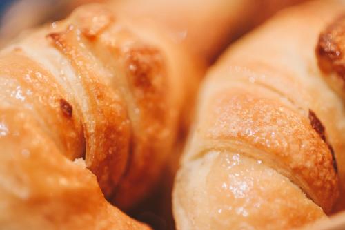a close up of two cinnamon rolls with a hole at LG Golden Suites in San Miguel de Tucumán