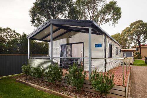 a mobile home with a black roof at Anchor Belle Holiday Park in Cowes