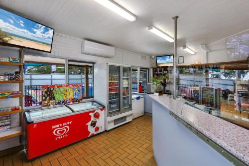 a store with a store front with a counter sidx sidx sidx at Anchor Belle Holiday Park in Cowes