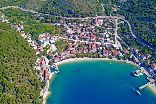 an aerial view of a village next to a lake at Apartments by the sea Drvenik Donja vala, Makarska - 11553 in Drvenik