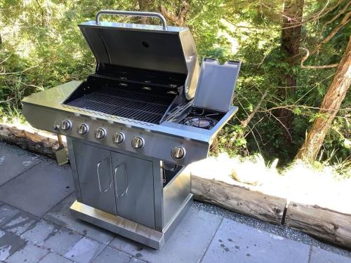 a barbecue grill sitting on top of a patio at Flo inn in Ucluelet