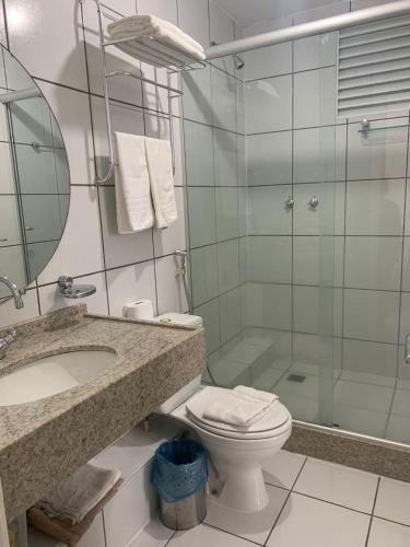 a bathroom with a sink and a toilet and a shower at GRAN LENÇÓIS FLAT - APTO PARTICULAR in Barreirinhas