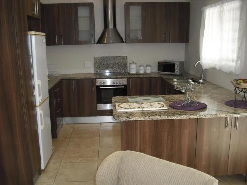 Η κουζίνα ή μικρή κουζίνα στο Grace Holiday Home