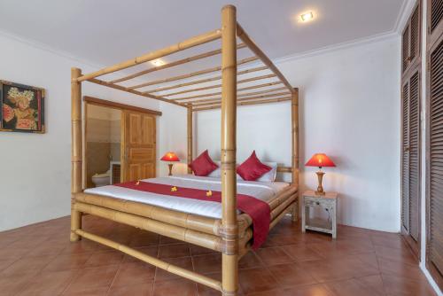 Ένα ή περισσότερα κρεβάτια σε δωμάτιο στο Villa Dinding Batu