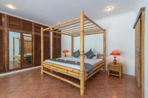 Ένα ή περισσότερα κρεβάτια σε δωμάτιο στο Villa Dinding Batu
