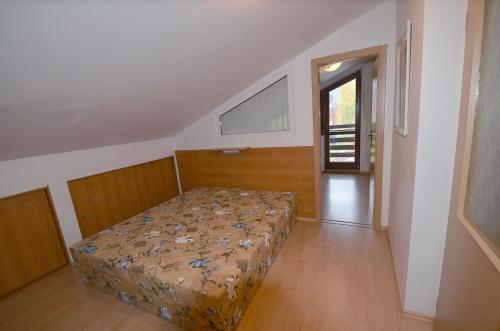 Postel nebo postele na pokoji v ubytování Apartement Hrebenka