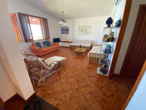 an overhead view of a living room with a couch and chairs at La Casa sulla Spiaggia: Dimora Elma in San Lorenzo