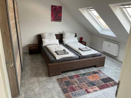 a bedroom with two beds in a attic at Apartment near Bonn/Cologne with nature access in Troisdorf