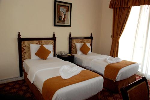 Postel nebo postele na pokoji v ubytování Diwan Al Amir