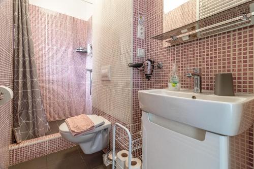 a small bathroom with a sink and a toilet at Bratislava -apartment near the City center with a balcony in Bratislava