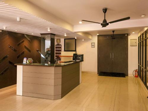a kitchen with a counter in a room at Shivani Palace Hotel, Restaurant & Party Hall in Seonī