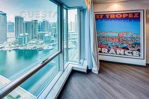 a room with a window with a view of a city at Marina Promenade, Dubai Marina in Dubai