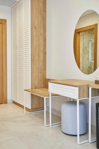 a dressing room with a desk and a mirror at Rammos Managed By Dedeman in Bodrum City
