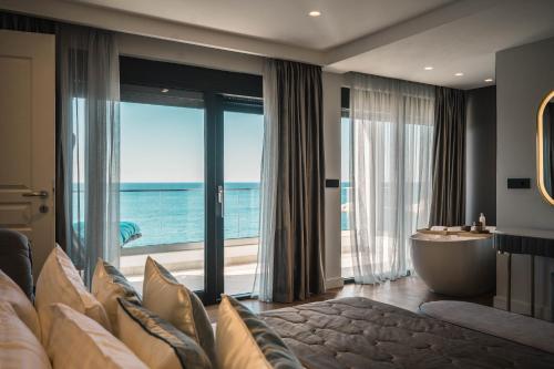 a hotel room with a view of the ocean at Apartments Eneida in Ulcinj