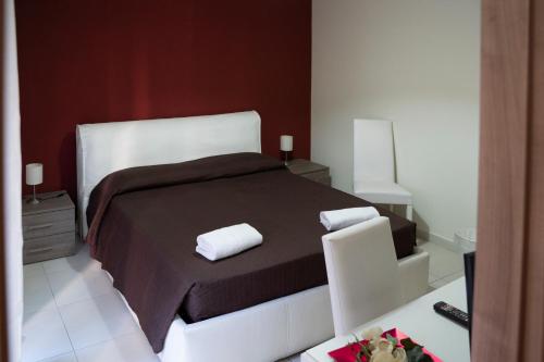 Een bed of bedden in een kamer bij La Dimora Dei Mori